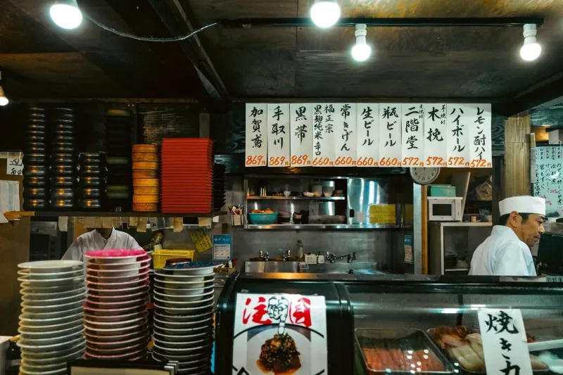 Pull Up a Stool: The Case for Abandoning Your Booth and Eating at the Counter